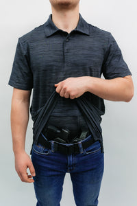 A man wearing the varda concealed carry shirt in grey demonstrating the double layer design 